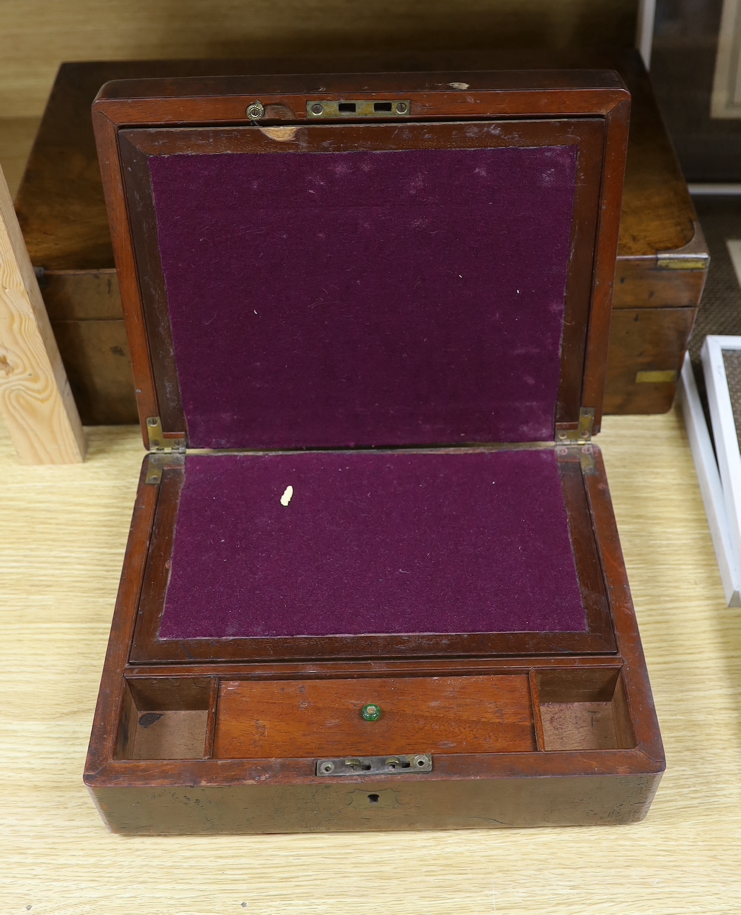 A brass bound Victorian mahogany writing slope and another smaller writing slope, 45cm wide, 15cm high